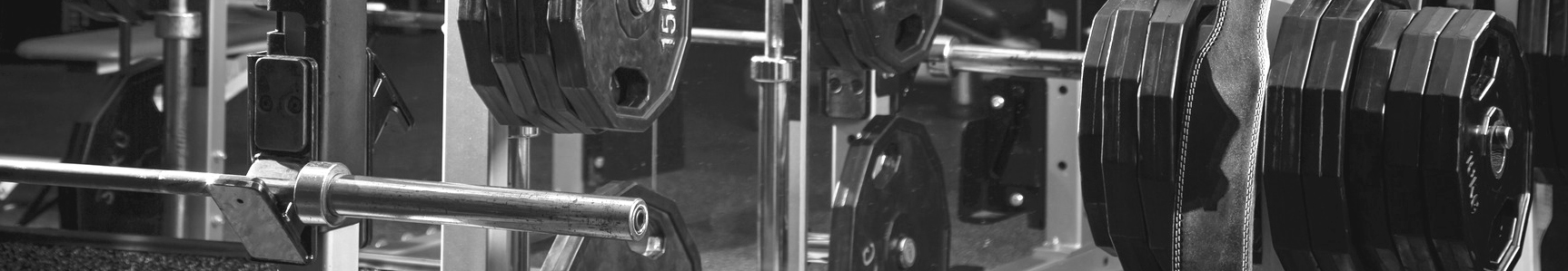 Weight lifting equipment in a club gym.